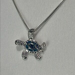 Gorgeous Blue Accented Silver Turtle Necklace. 1”x 1”.